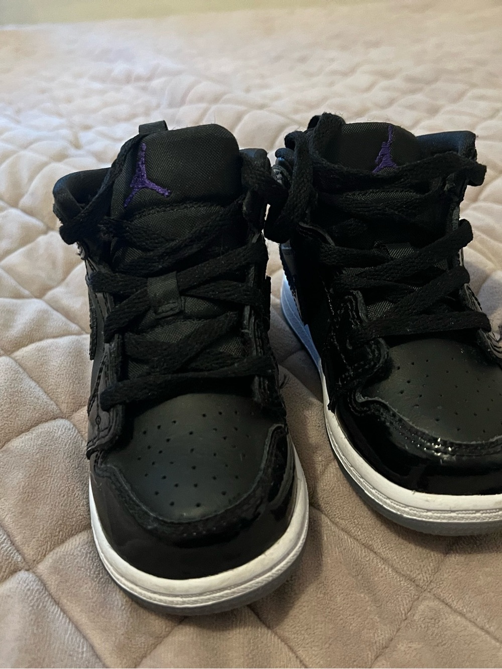 Kids Jordan’s Black and Purple Athletic High-Top Sneakers